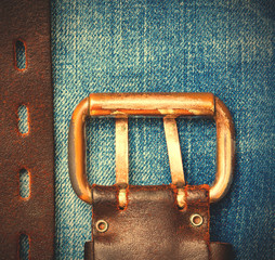 Aged leather belt with a buckle