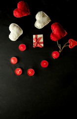 Valentine's Day. Red and white hearts on craft paper background. Beautiful red heart of roses, felt handmade. Black.