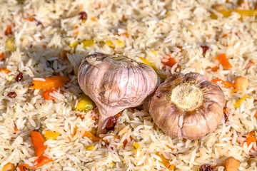 Cooking pilaf in a cauldron close-up as a background. National Asian food. Uzbek pilaf.