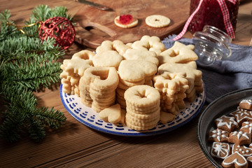 A pile of fresh Linzer Christmas cookies, ready to be filled with marmalade