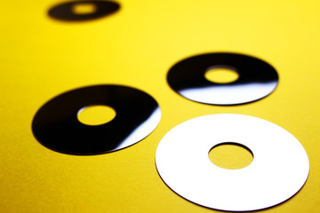 mirror discs on a yellow background