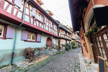 Obraz premium Traditional colorful half-timbered houses in Eguisheim Old Town on Alsace Wine Route decorated at Christmas, France