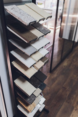 home furnishing store demonstrating variants of stone for kitchen countertop.