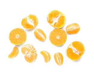 Pieces of sweet tangerines on white background