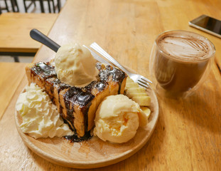 Isolated object, Brownie bread toast with ice cream banana and chocolate icing topping with flare morning sunlight
