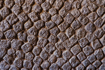 Paving stones texture. Gravel background and wallpaper. Surface of the old rock stone road.