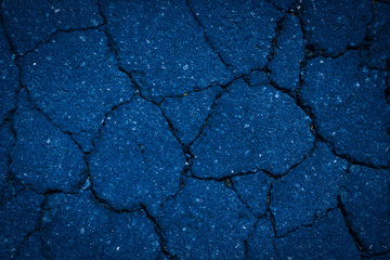 Broken cement floor for texture and background color of the year 2020 classic blue trend toning