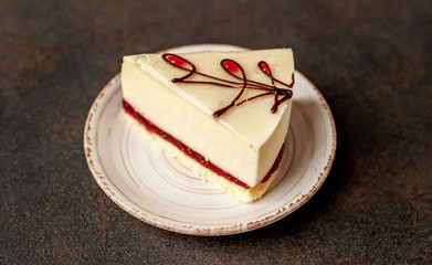 delicious cheesecake on a saucer with copy space for your text on a stone background