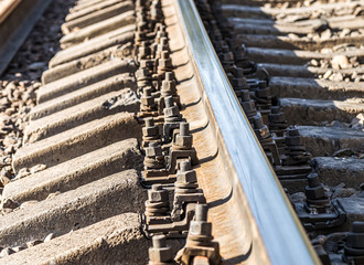 Fastenings of metal railway rails close-up
