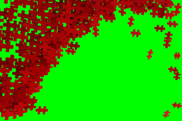 Puzzle pieces scattered on a left part of a green screen. 
