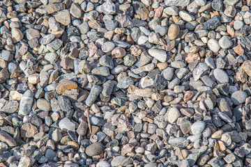 A large pile of building gravel outdoors as a background