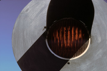 Train track signal against blue sky
