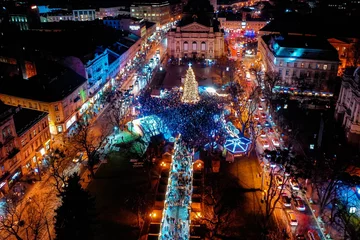 Fotobehang Opening of Christmas tree near Opera House in Lviv, Ukraine. View from drone © Ruslan