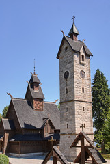 Fototapeta na wymiar Stone tower and the wood temple Wang in Poland ..