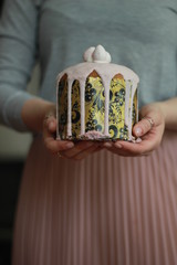 hand with easter cake