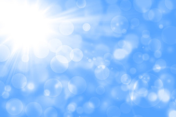Blurred abstract background with light blue and white gradient.