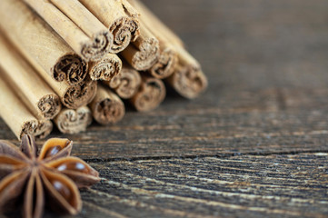 cinnamon sticks and anise on a wooden background