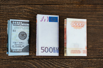 folded dollars, euros and rubles