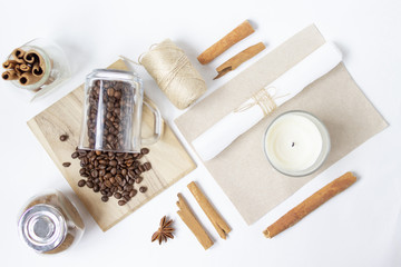 Beautiful layout with coffee beans and candle. Top view. Flat lay. Copy space. Place for text. White background.