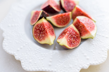 chopped figs on a white ceramic plate