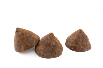 Three dark chocolate truffles.