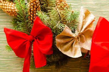 Christmas tree decoration toys. Balls, red bows on the Christmas tree and New Year's wreath. Merry...
