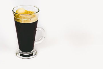 GLASS CUP OF COFFEE ON WHITE BACKGROUND