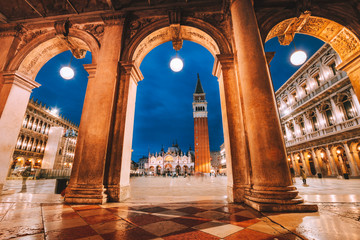 Venice, Italy. Scenic view of Piazza San Marco framed in architectural arches after dusk, blue hour