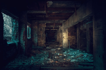 Dark creepy industrial tunnel or corridor with destruction and debris after crisis or disaster, toned