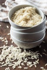 Uncooked indian long rice in bowl.