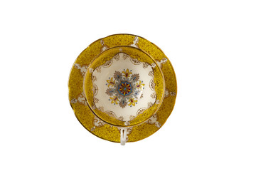 antique cup and saucer top view on a white background