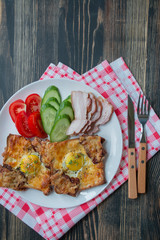 Grilled sandwich with egg, vegetables and bacon on a dark wooden background. Delicious breakfast. Place for text.