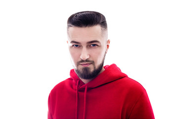 Handsome man in red casual clothes looking in camera isolated on white background