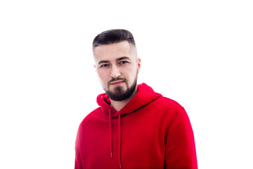 Handsome man in red casual clothes posing on white background