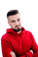 Obraz premium Handsome man in red casual clothes posing with arms crossed on white background