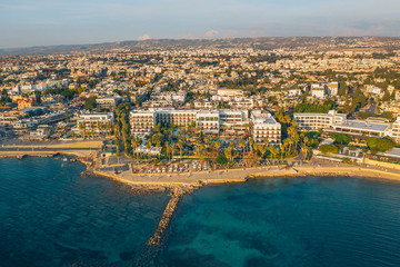 Paphos, Cyprus, aerial panorama of promenade with seaside, hotels and buildings of mediterranean tourist resort. Travel to Cyprus concept.