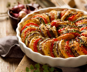 Vegetable tian, Provencal vegetable casserole, delicious and nutritious vegetarian meal, close-up - obrazy, fototapety, plakaty