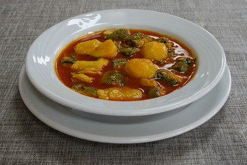National Spanish cuisine of Valencia. Unique delicious Allipebre dish. Freshwater eel from Lake Albufera stewed with potatoes. Travel to Valencia.