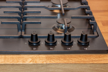 The control panel of the gas hob, the knob for adjusting the intensity of combustion of the gas...