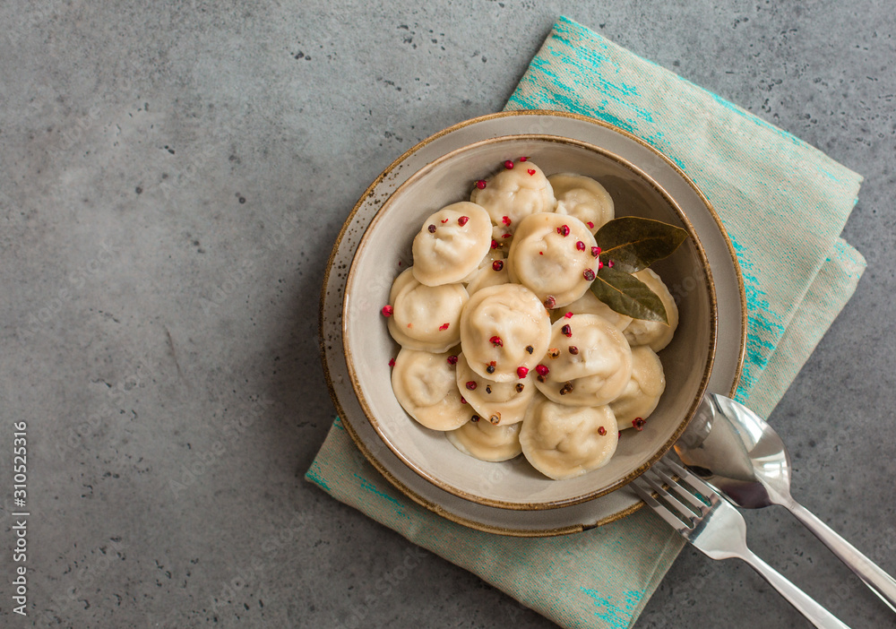 Poster Homemade pelmeni - russian dumplings with minced meat: pork and beef. 