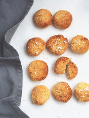 Delicious just baked homemade coconut biscuits on white background.