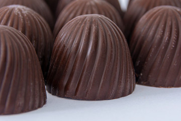 Chocolate candies. close-up. sweet, chocolate background.