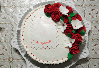 Festive beautiful and delicious cake decorated with cream flowers