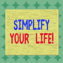 Conceptual hand writing showing Simplify Your Life. Concept meaning focused on important and let someone else worry about less ones Square rectangle unreal cartoon wood on the coloured wall