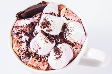 Cup of hot chocolate with marshmallows on a white background