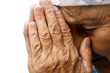 Grandma asking for help. Old grandmother praying to the Almighty
