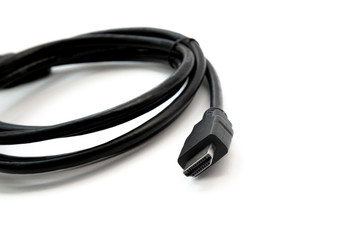 Black HDMI cable on white background. Connector close-up.