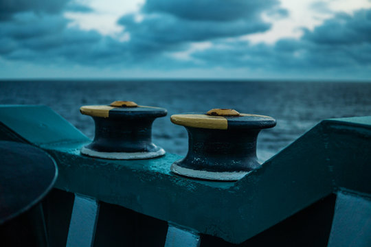 Ship mooring equipment at sea. Warping Rollers painted with yellow.
