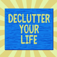 Handwriting text writing Declutter Your Life. Conceptual photo To eliminate extraneous things or information in life Square rectangle unreal cartoon wood wooden nailed stuck on coloured wall