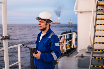 Marine Deck Officer or Chief mate on deck of offshore vessel or ship , wearing PPE personal...